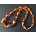 An amber necklace along with one other ( A/F)