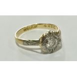 An 18ct gold ring with diamond set in platinum.