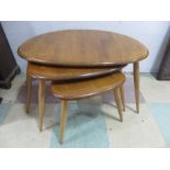 A nest of three Ercol "pebble" tables