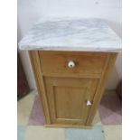 A small marble topped pine cupboard with single drawer