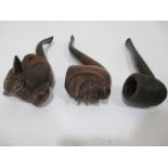 Three vintage pipes,carved, a bull, one carved with a face and a Royal Sovereign