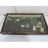 A tabletop display cabinet A/F along with contents including stamps, misc items