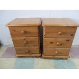 A pair of pine bedside cabinets