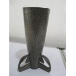 A pewter vase with a mortar shell shaped body and fins, height 24cm