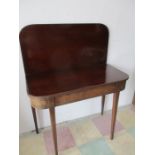 A Georgian mahogany tea table with box wood stringing