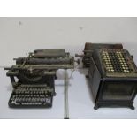 A vintage Burroughs adding machine along with a Remington typewriter (A/F)