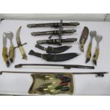 A collection of various knives, Kukris etc.