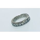 An 18ct white gold diamond set full eternity ring. Set with twenty two round brilliant cut diamonds.