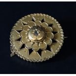 An unmarked gold (probably 15ct) Victorian brooch set with a central diamond. Weight 7.4g