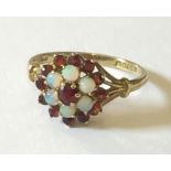 A 9ct gold garnet and opal cluster ring.