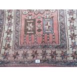 A small Eastern red ground rug