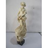 A plaster figure of a classical lady along with a plaster head on marble base
