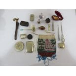 A collection of small miscellaneous items including silver cigar cutter, beaded bag A/F, button