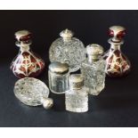 A collection of silver topped and overlaid perfume bottles, some A/F