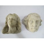 The marble head of a girl along with a stone head of a man