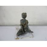 A figure of girl on perspex base