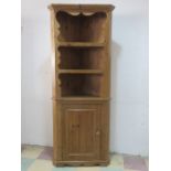 A pine corner cupboard