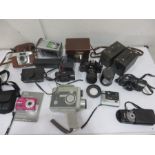 A collection of various cameras, lenses etc including Kodak, Canon, Rollei, Brownie, Sigma