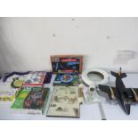 A collection of various games and miscellaneous items