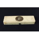 A small ivory box with velvet lining. The box containing a lock of hair inset to the top. (