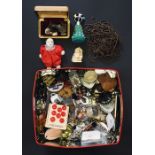 A collection of small miscellaneous items including badges, tie pins, cuff links, costume jewellery,