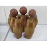 A set of 9 wooden skittles with three balls