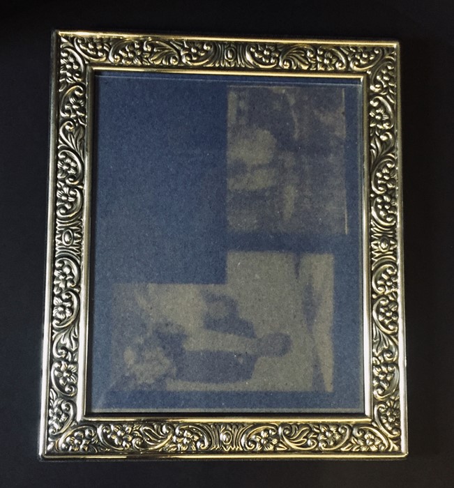 A hallmarked silver photo frame, 32cm x 27cm