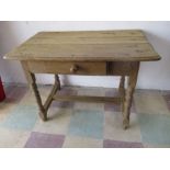 An antique elm table with single drawer