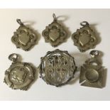 Five hallmarked silver medallions along with a Victorian brooch. Total weight 62.2g