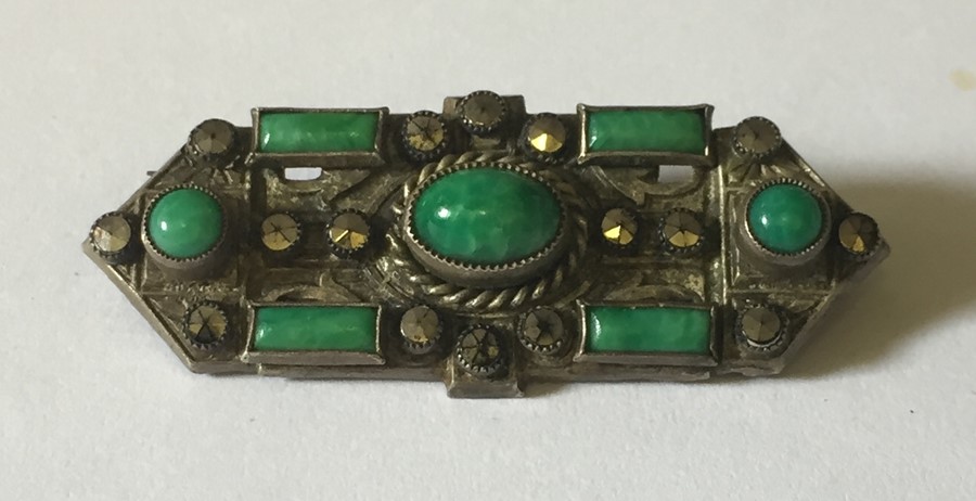 An Art Deco SCM brooch with marcasites and jadeite.