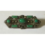 An Art Deco SCM brooch with marcasites and jadeite.