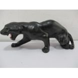 A figure of a crouching panther stamped "Progressive Art", 40cm