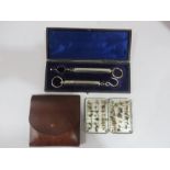 A cased pair of Salter fishing scales along with a quantity of flies in metal Wheatley case in a
