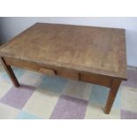 An oak coffee table with single drawer