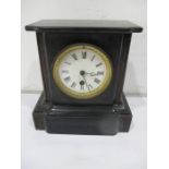 A black slate mantle clock
