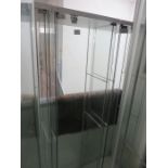 A lockable glass display cabinet with three shelves