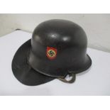 A German WWII police helmet with double decals and leather neck protector
