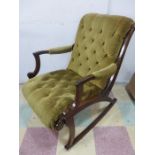 An upholstered button backed rocking chair