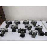 A collection of various Canon cameras and lenses etc