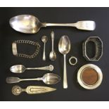 A collection of hallmarked silver including photo frame, cutlery, bracelet and continental silver