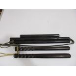 Two antique truncheons, ebony rulers and a whip
