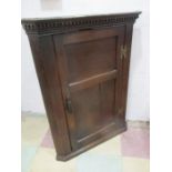 An antique oak hanging corner cupboard- key in office