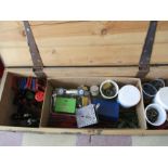 A wooden ammo case containing vintage Meccano and instruction booklets