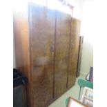 An Art Deco burr walnut triple wardrobe