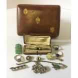 A small quantity of costume jewellery including an Art Deco bar brooch, silver ring etc in a leather