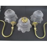 A pair of Victorian converted brass gas lights marked "Sugg" along with a set of three etched