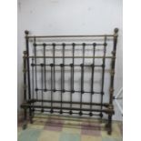 A brass and iron bed