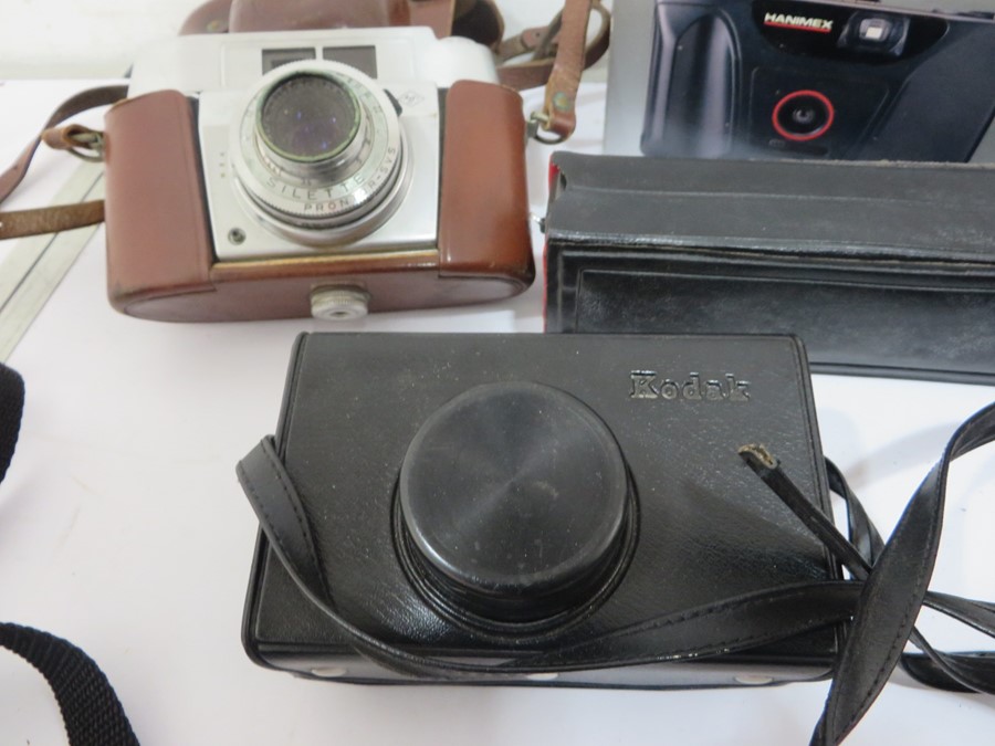 A collection of various cameras, lenses etc including Kodak, Canon, Rollei, Brownie, Sigma - Image 12 of 13