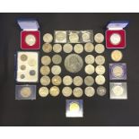 A collection of crowns, £5 coins, medallions and silver proof coins.