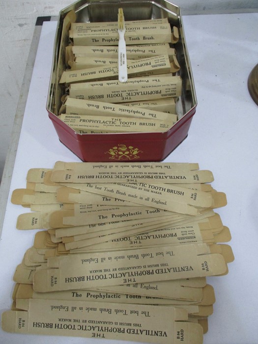 A collection of new old stock boxes"The Prophylactic Tooth Brush" along with a number of